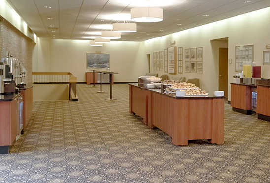 a long hallway with a buffet table in the middle