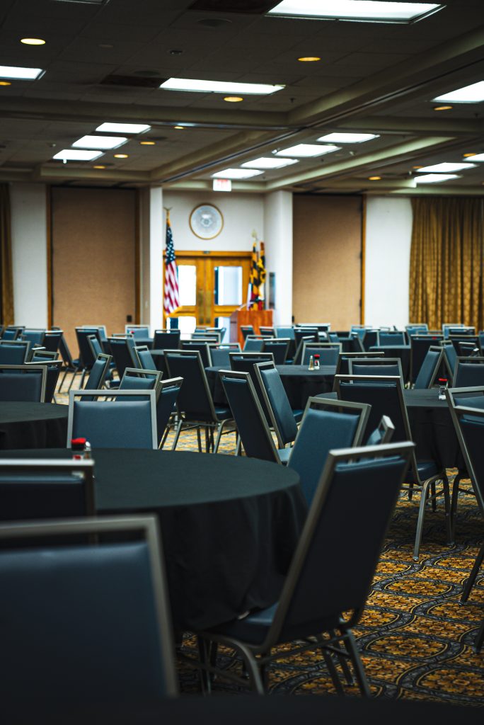 Maritime Conference Center conference room filled with circular tables and chairs