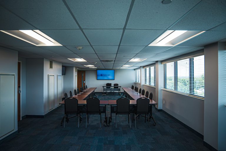 Maritime conference center meeting room space with a U-shaped table and chairs