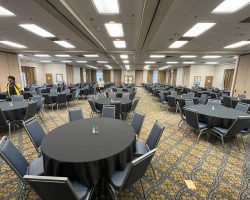 MCC's Chesapeake dining room filled with circular tables and chairs